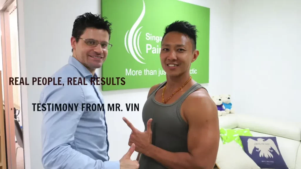 A certified male/female chiropractors/sports massage therapist performing stretches on a patient in a modern Singapore clinic.