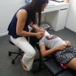 Dr Jenny treating her child patient's neck 2