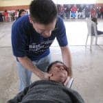 Dr Jeff treating his patient's neck in Peru