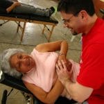 Dr Jeff treating an elderly patient in Peru