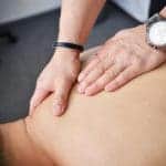 SGPS Sports Massage - Chiropractor massaging his patient's back 3