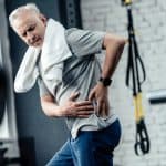 senior sportsman with back pain