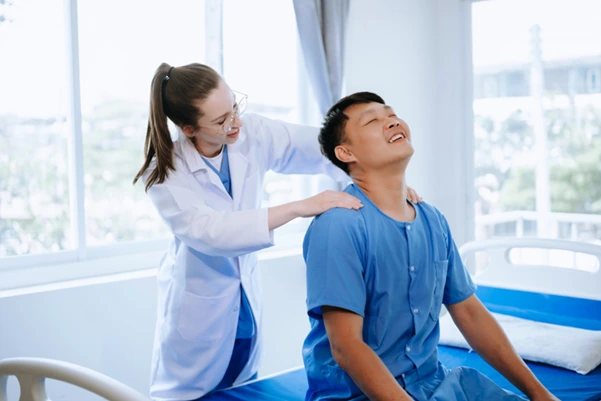 A patient undergoing chiropractic treatment for neck pain