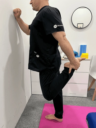 Standing quadriceps stretch exercise